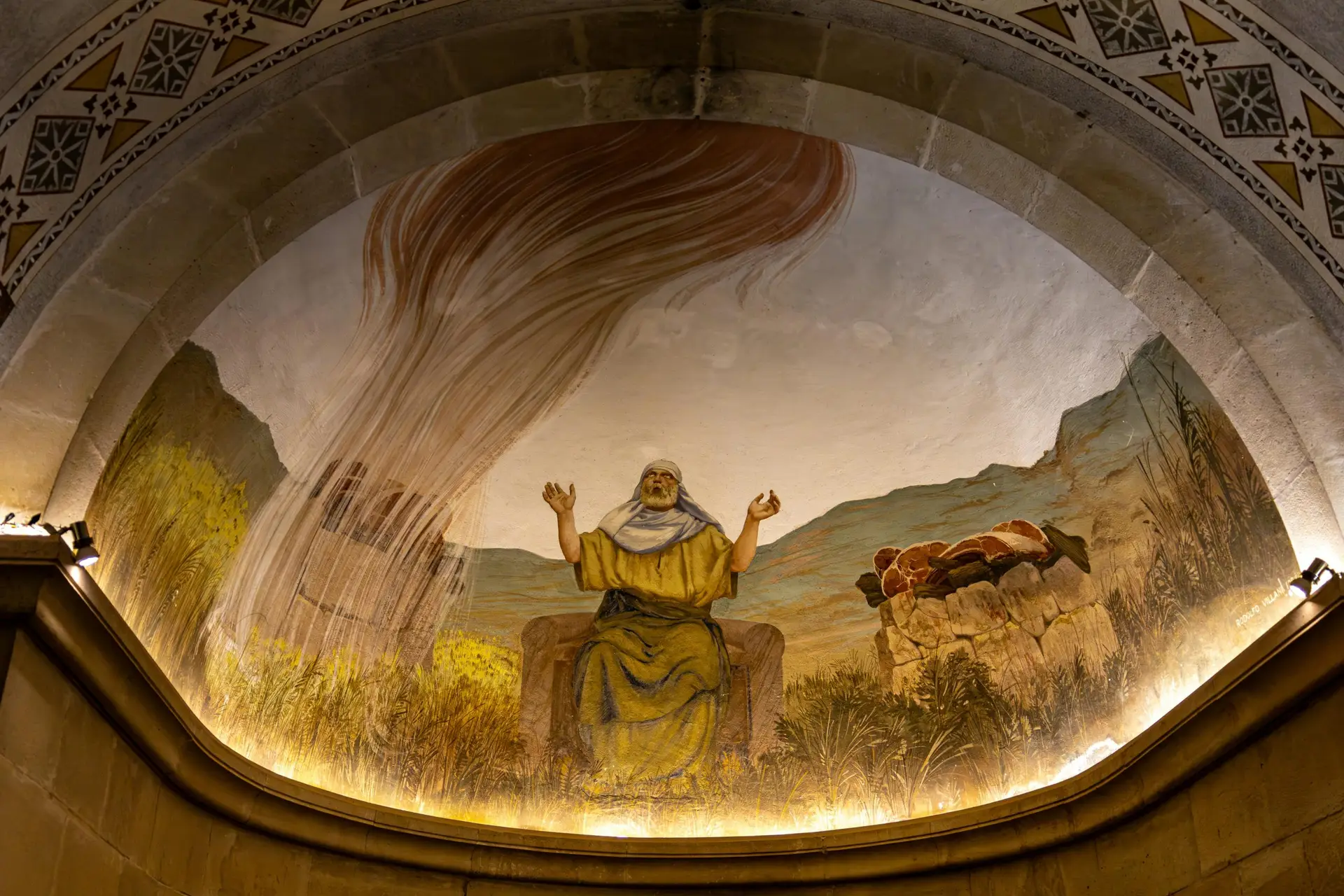Vibrantly painted mural depicting a figure surrounded by nature in a historic archway.
